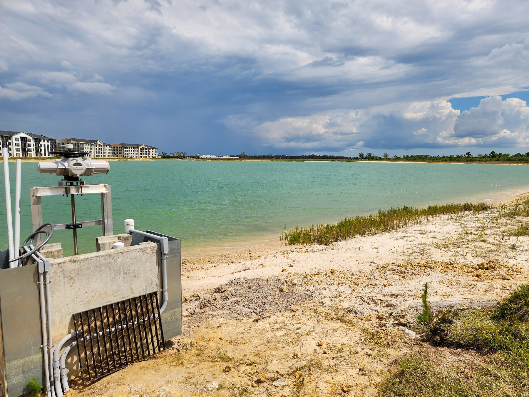 A sensor device sits at lakeside to control water levels.