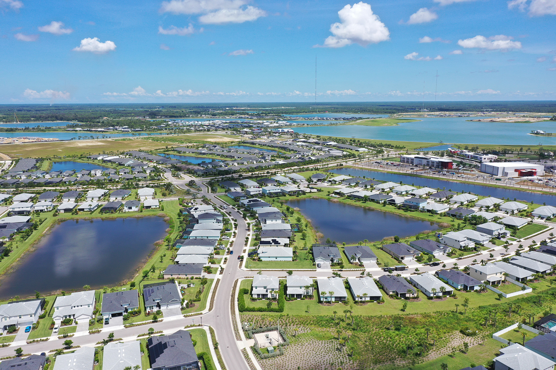 Houses, streets, and lakes dot the landscape