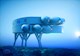The rendering shows a modular underwater laboratory with multiple stories and large protuberances. 