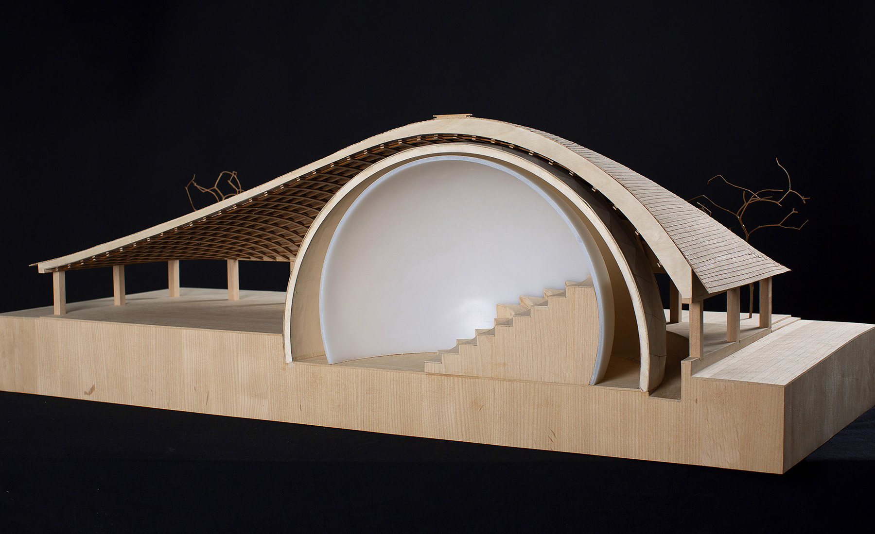 A cutaway model shows how the roof sweeps up and over the dome.