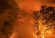 firefighters battle a giant forest fire