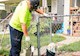 two men work to replace a service line