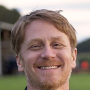 man smiles for the camera