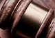 brown gavel rests on a table