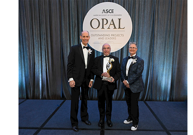 Robert Prieto being presented with the OPAL award in management